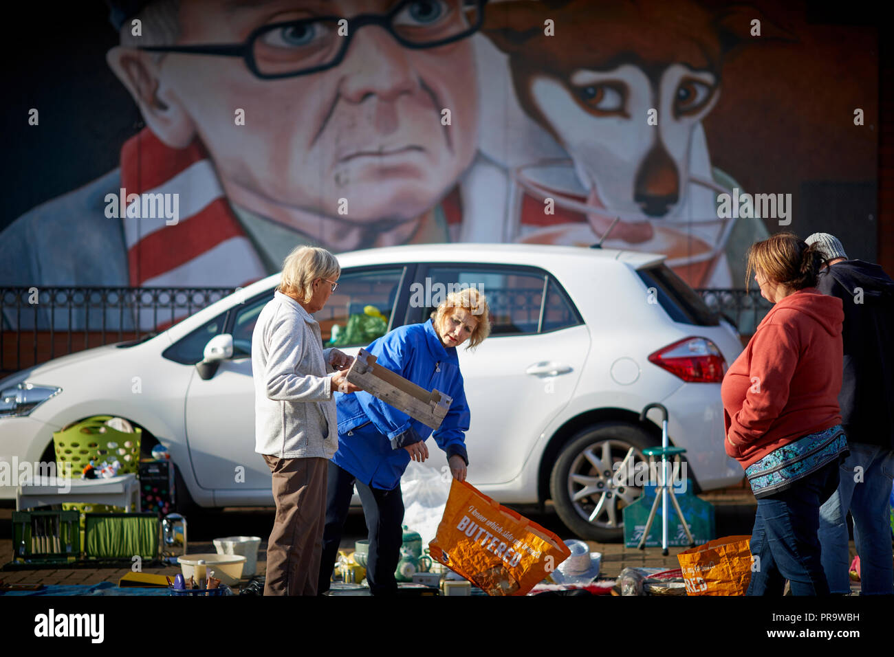 Car boot sale at the market hall with mural behind Stoke-on-Trent, Staffordshire Stock Photo