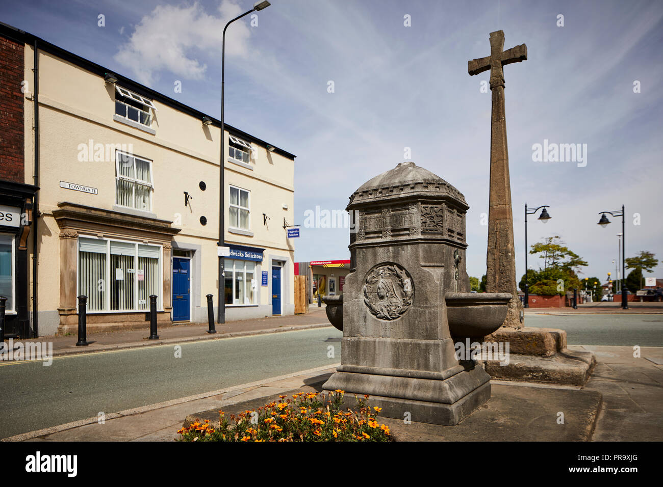Leyland in Lancashire, England. Leyland Medieval cross and drinking well at Worden lane Stock