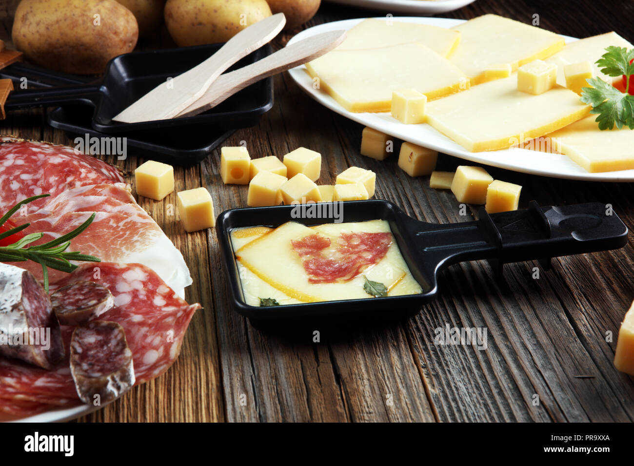 Swiss Raclete Delicious traditional Swiss melted raclette cheese on diced boiled or ...