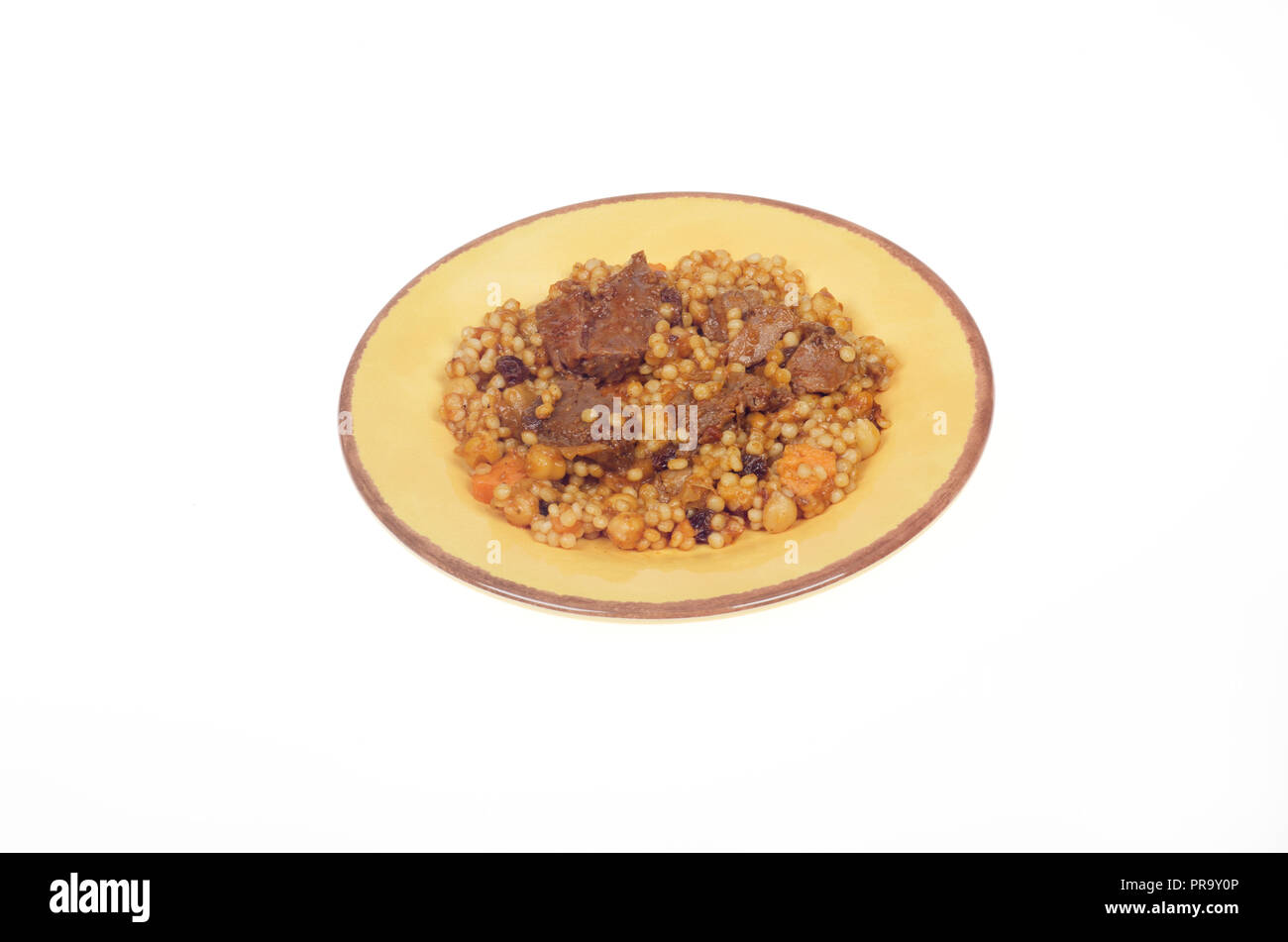 Plate with Morroccan style beef with couscous, carrots and chick peas Stock Photo