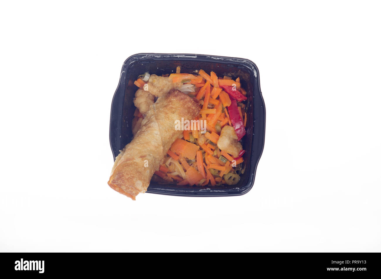 Chicken Pad Thai with vegetable egg roll in microwaved black plastic  tray Stock Photo