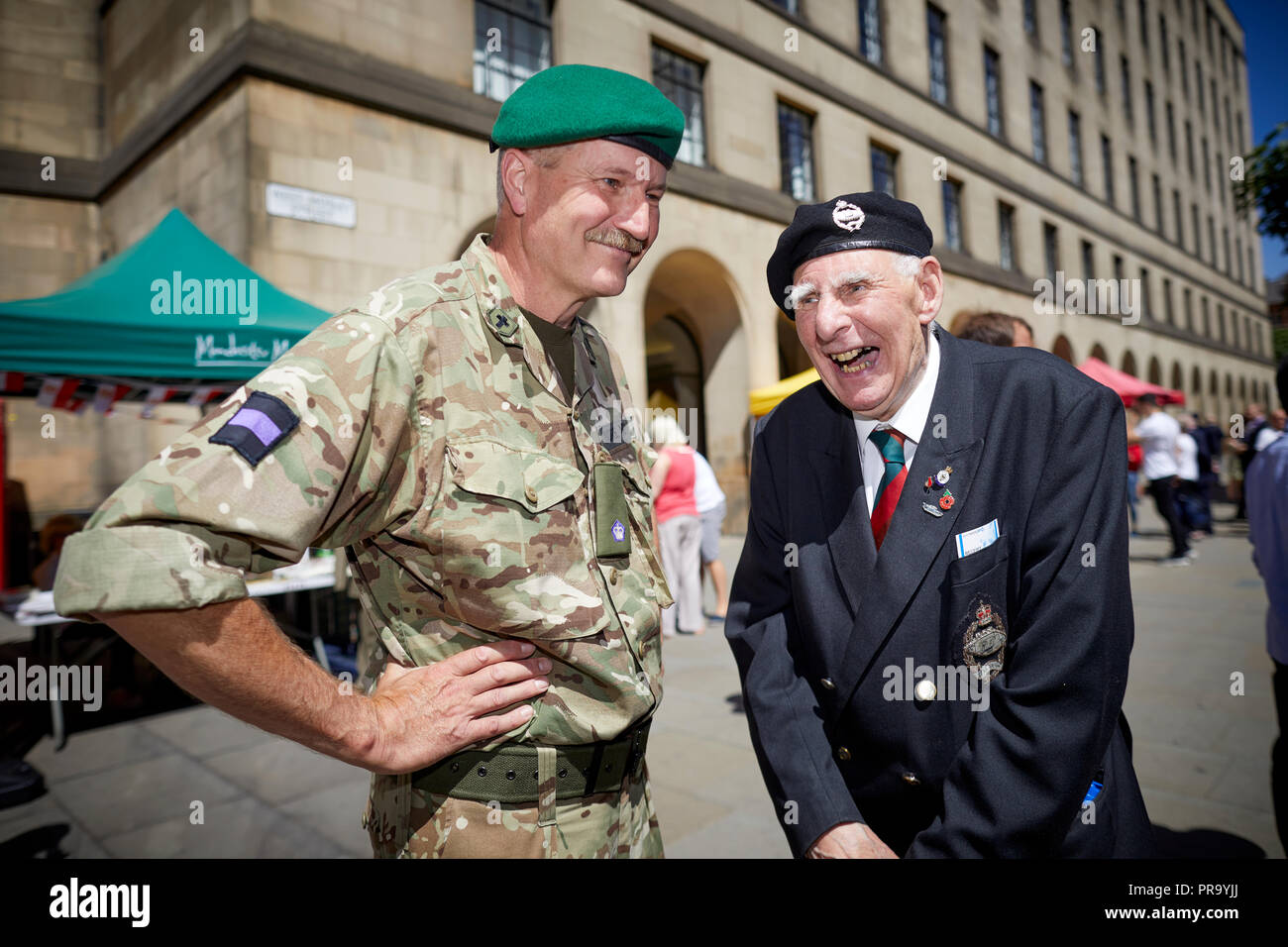 Manchester celebrates Armed forces Day in Peters Square   Jack Wilson aged 88 from Sale chatting with serving Mile Newman 6MI Stock Photo