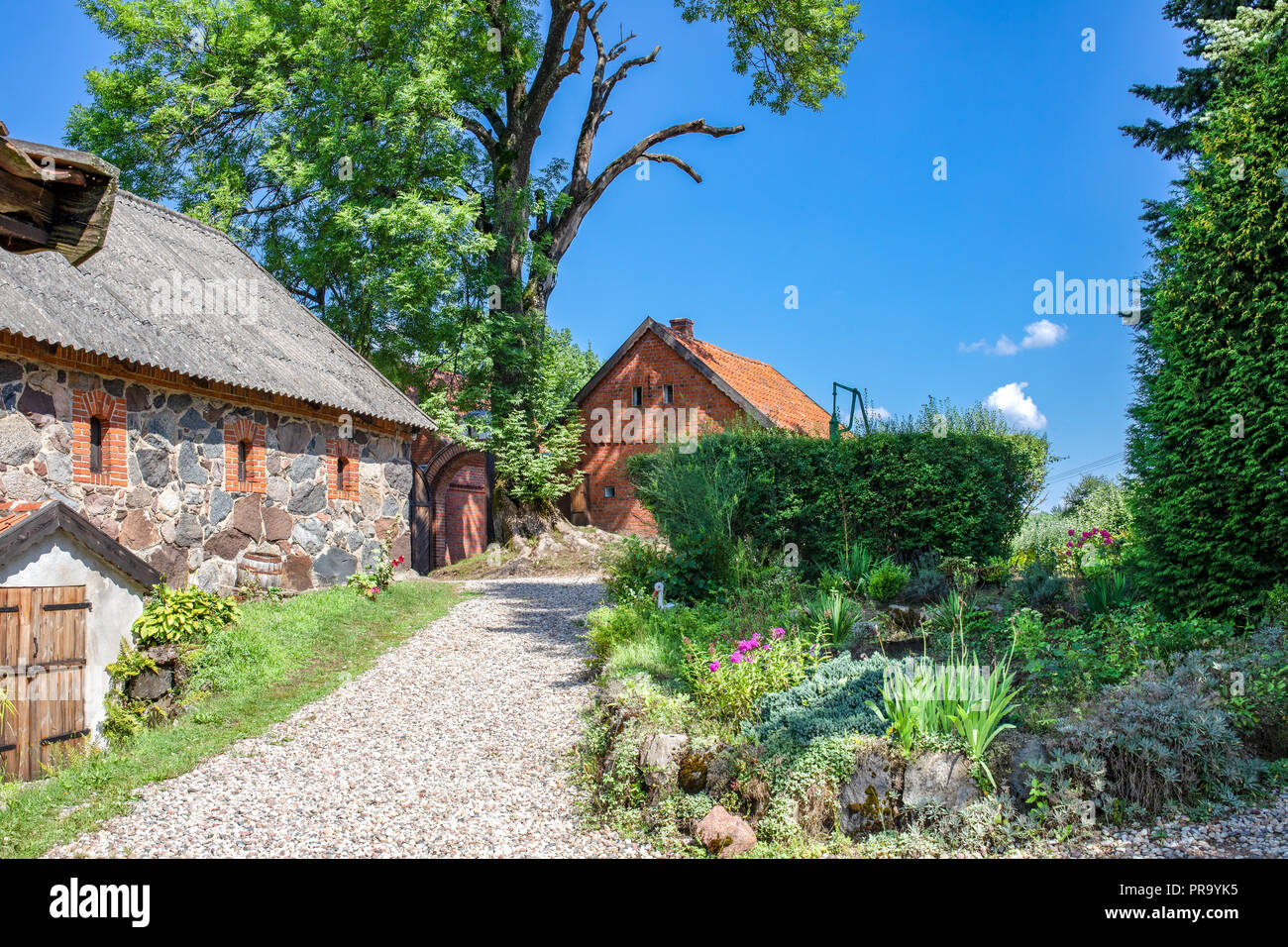 Polish Masuria lake district. Typical east prussia architecture. Wojnowo / Eckertsdorf. Poland. Stock Photo