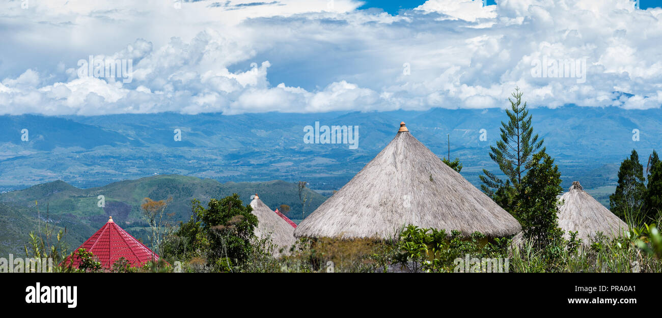 Panoramic view of Baliem Valley, with grass-topped huts. Wamena, Papua, Indonesia. Stock Photo