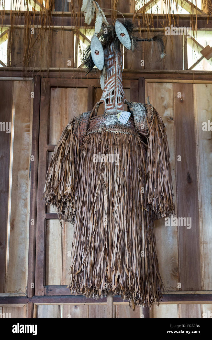 A traditional grass skirt indigenous woman wear hanging on a wall. Wamena, Papua, Indonesia. Stock Photo