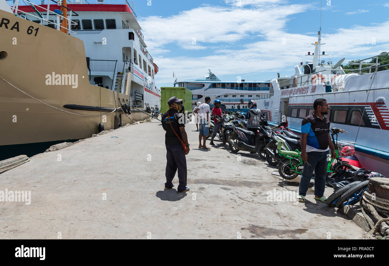 Numerous ferry boats at a busy sea port. Sorong, Papua, Indonesia. Stock Photo