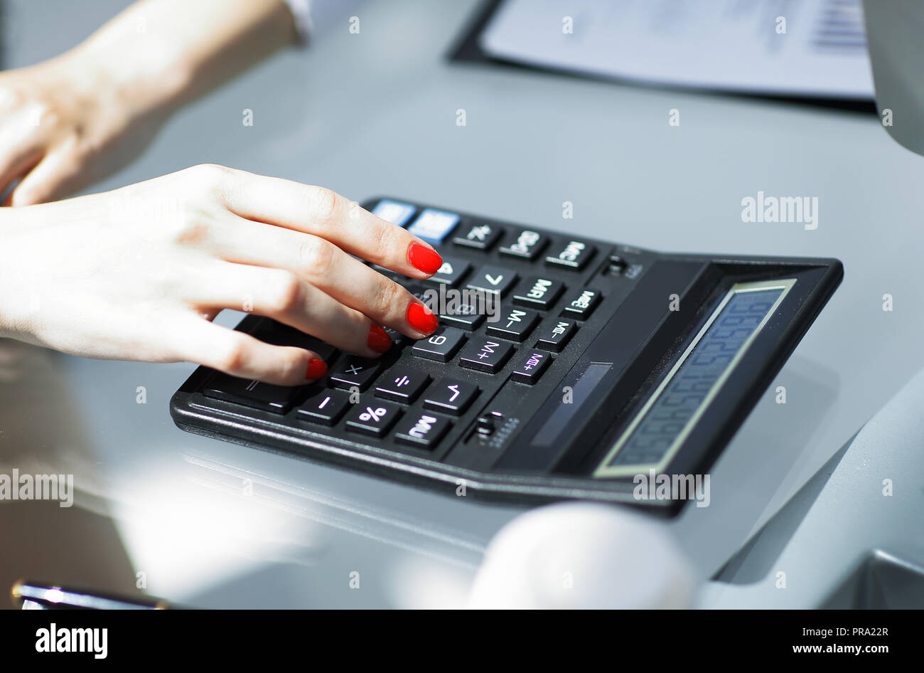 Businessman using calculator checking paperwork hi-res stock ...
