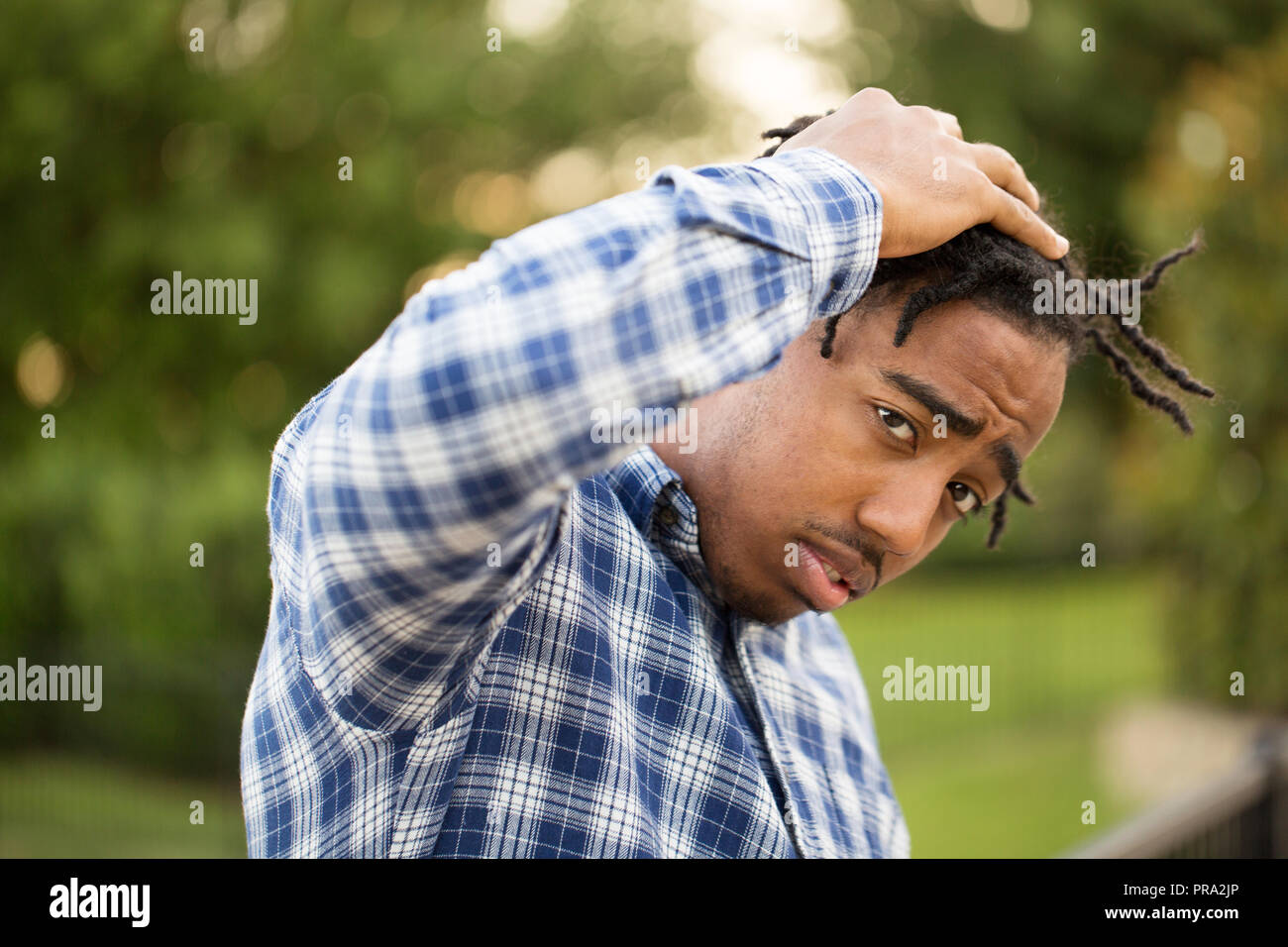 Young African American man in deep thought. Stock Photo