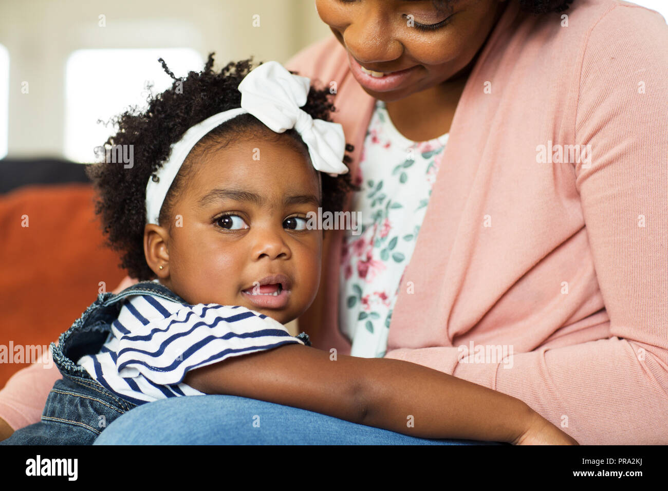 African American family. Mother and daughter smiling at home. Stock Photo