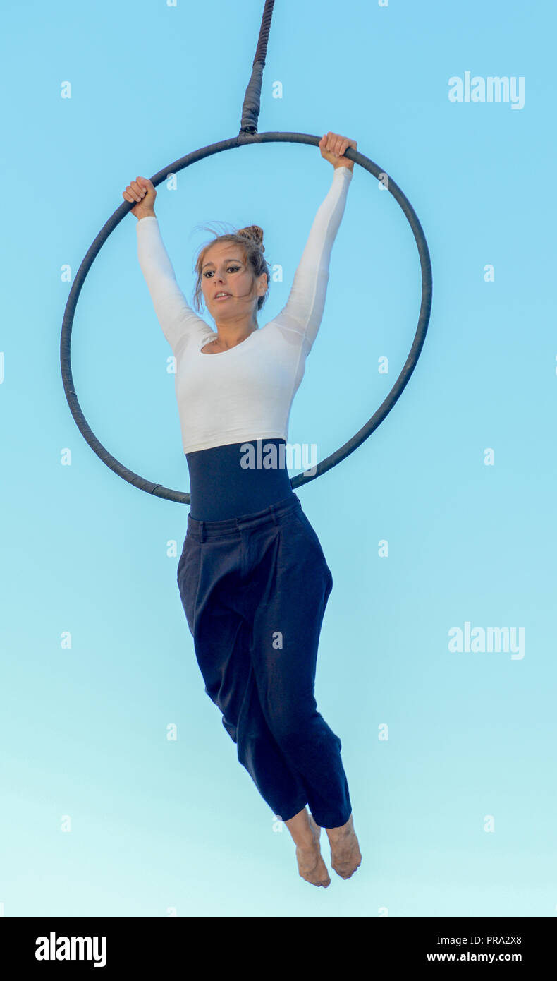 Lugano, Switzerland - 15 July 2016 - Lugano, Switzerland - 15 July 2016 -  Woman acrobat on a hula hoop does tricks at Buskers Festival in Lugano, Swi  Stock Photo - Alamy