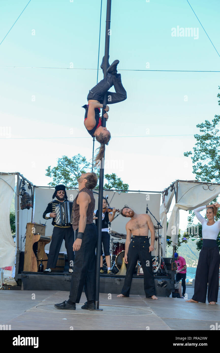 Lugano, Switzerland - 15 July 2016 - Acrobats doing tricks at Buskers Festival in Lugano, Switzerland Stock Photo