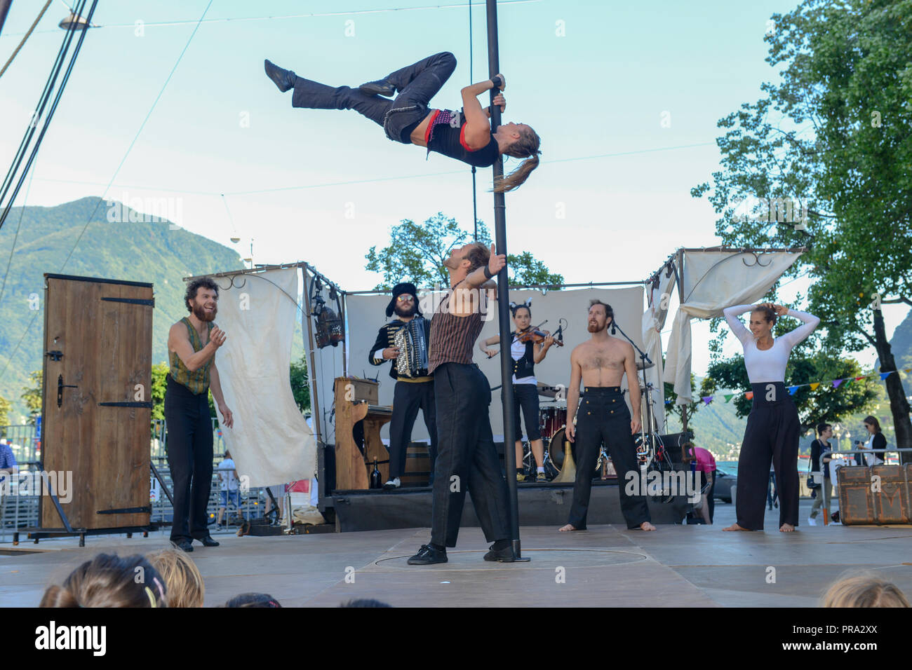Lugano, Switzerland - 15 July 2016 - Acrobats doing tricks at Buskers Festival in Lugano, Switzerland Stock Photo