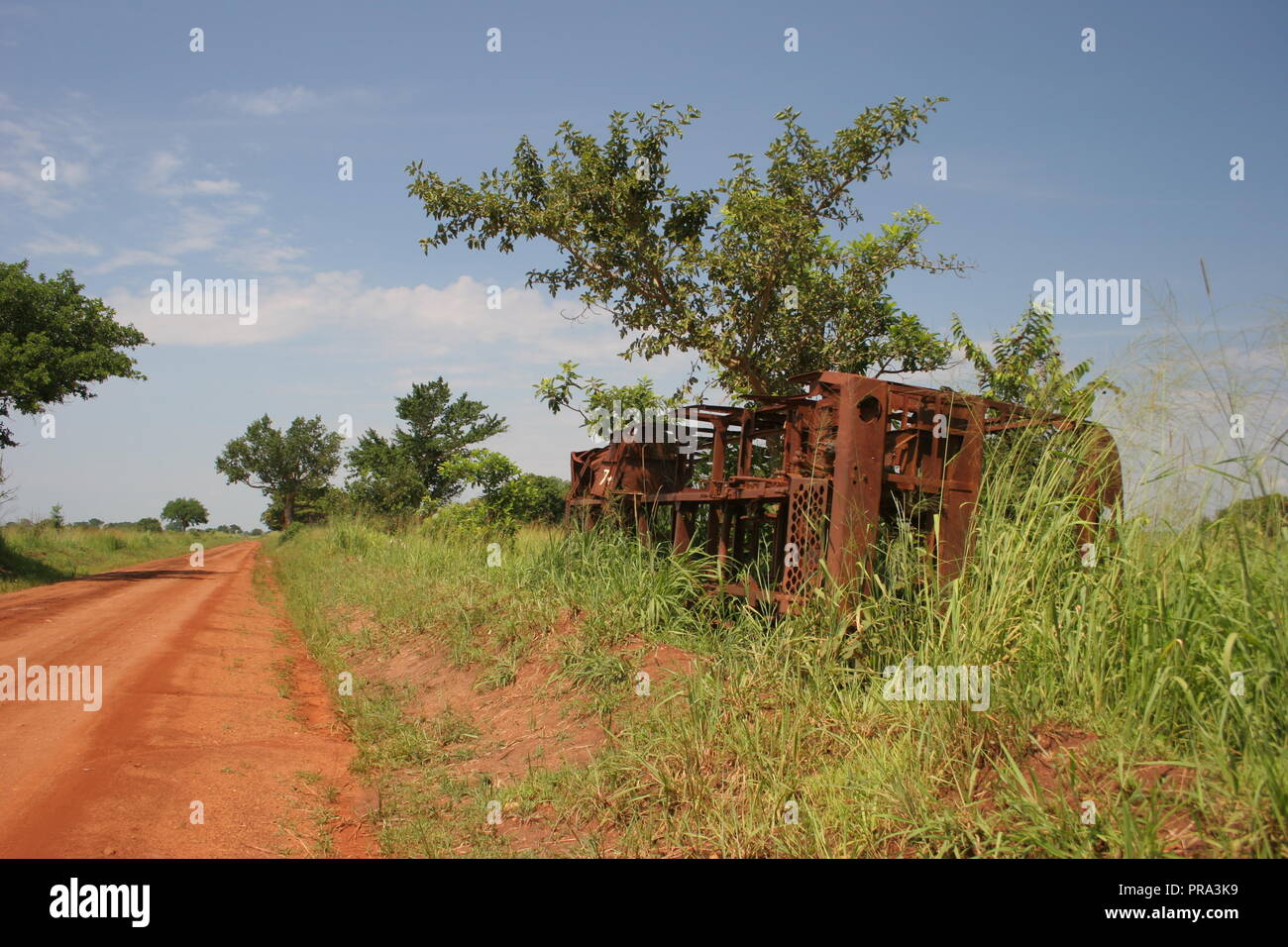 The wreckage of a vehicle along the Atiak- Gulu highway, where The Lords Resistance Army laid many deadly ambushes during its insurgency. Stock Photo