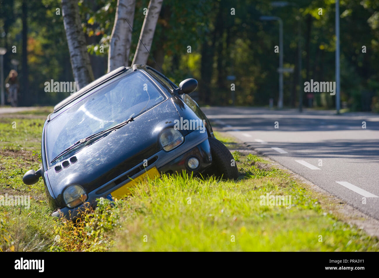 A car had driven into a ditch Stock Photo