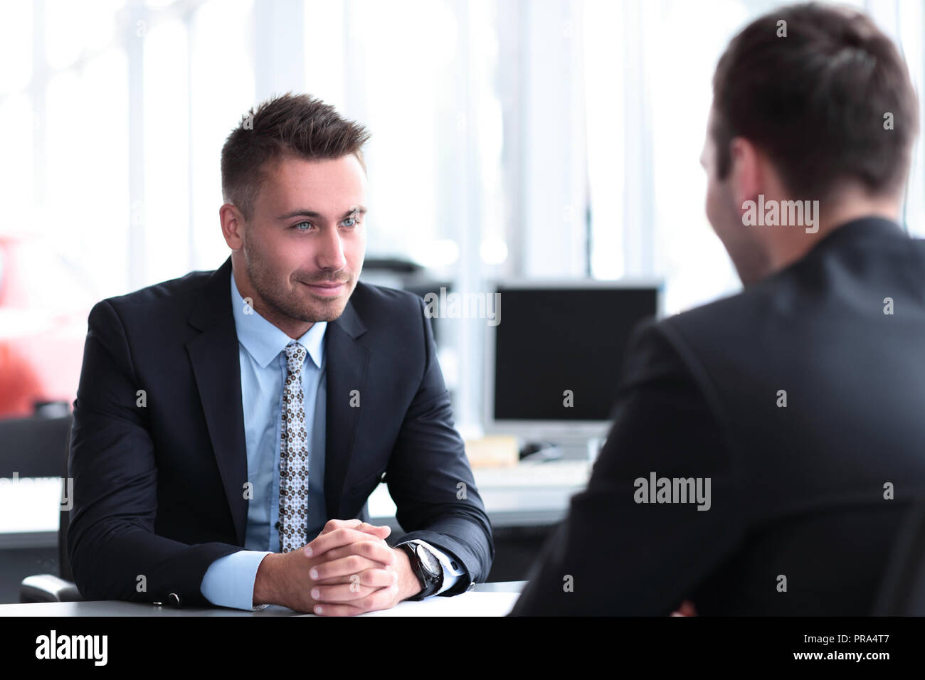 Two handsome businessmen in office Stock Photo - Alamy