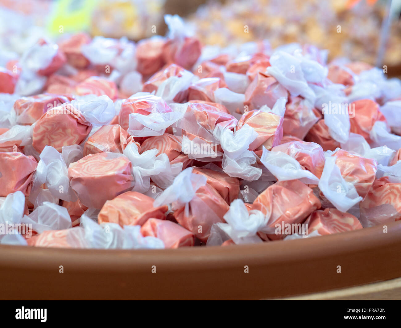 Pile of cherry taffy candy sitting inside of a candy store Stock Photo