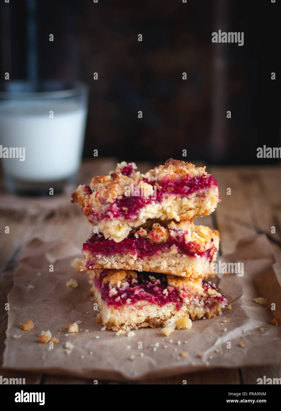 Close-up of raspberry crumb bars on wooden background Stock Photo