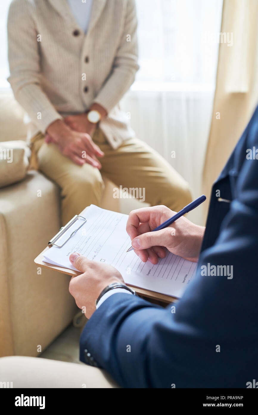 Psychiatrist Taking Notes Stock Photo