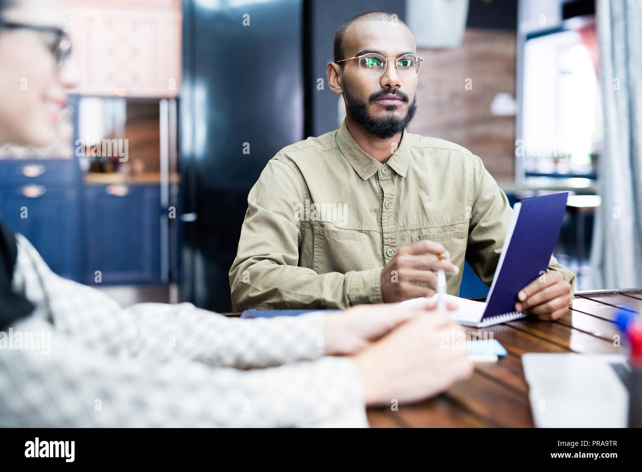 Bearded man discussing project at meeting Stock Photo
