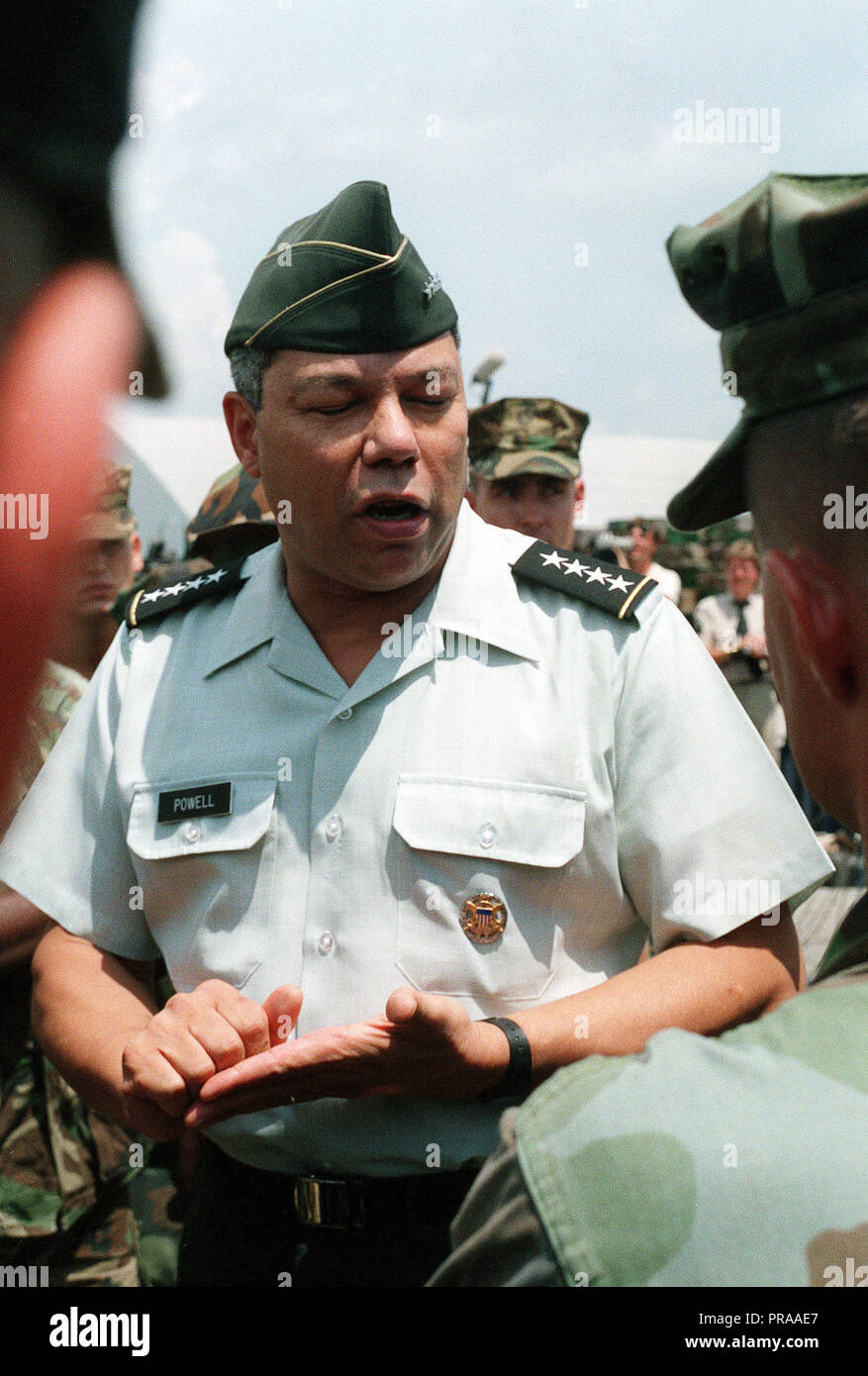Gen. Colin Powell, chairman, Joint Chiefs of Staff, addresses a Marine during a visit to elements of the 2nd Marine Division departing the U.S. to participate in Operation Desert Shield. Stock Photo