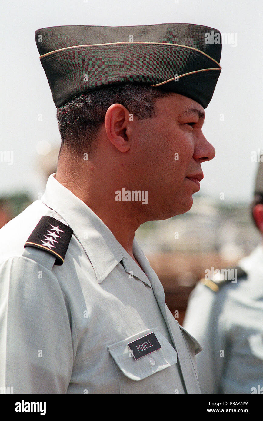 Gen. Colin Powell, chairman, Joint Chiefs of Staff, watches as members of the 2nd Marine Division prepare to depart to take part in Operation Desert Shield. Stock Photo