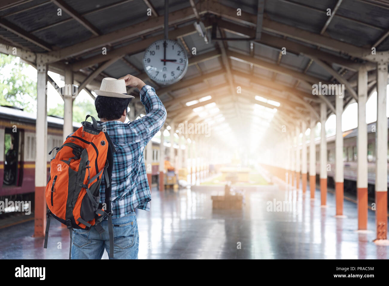 Asian Traveler Man With Belongings Waiting For Travel By - 