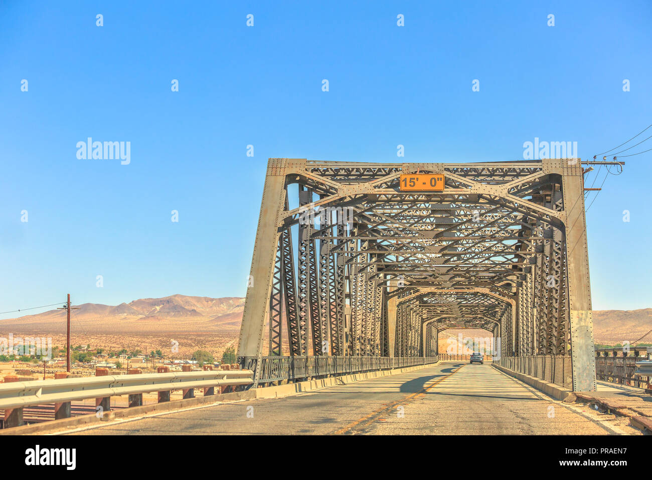 Iron bridge over the railroad in Barstow California on the historic Route 66 with Mojave desert on background. North 1st Street Bridge. Stock Photo