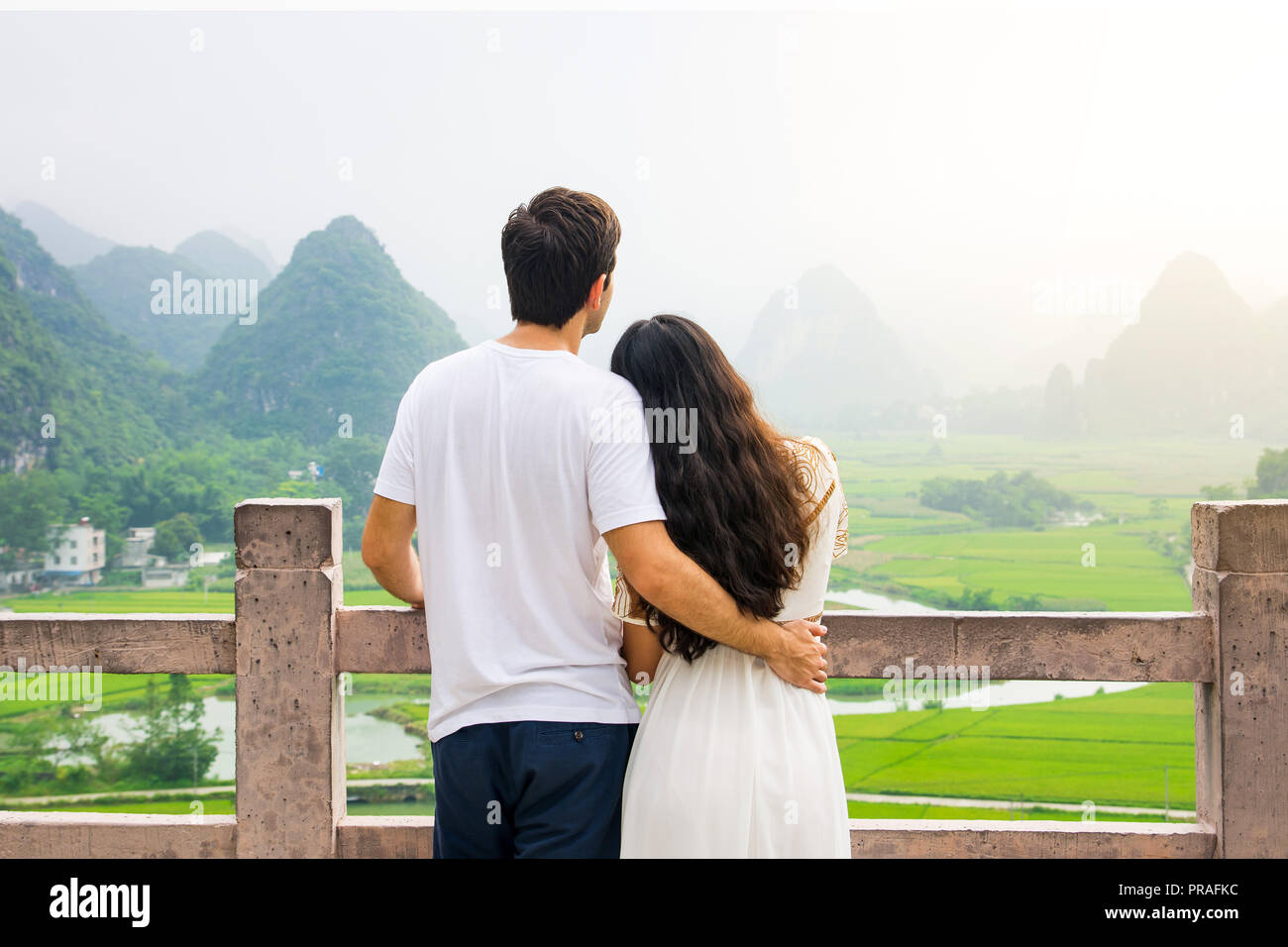Couple enjoying Karst mountain view together from platform Stock Photo