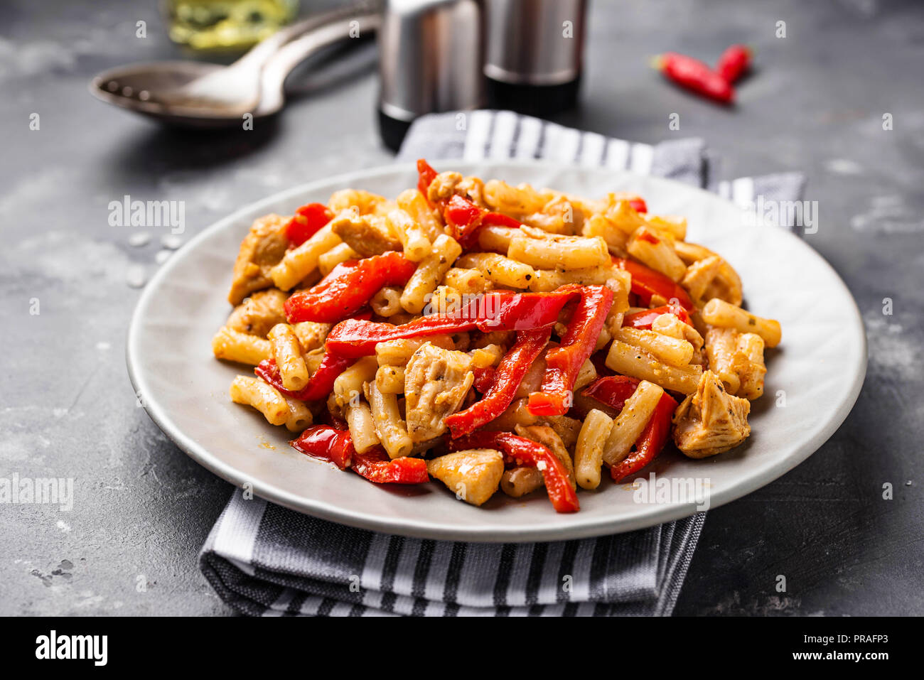 Pasta with chicken and pepper in tomato sauce Stock Photo - Alamy