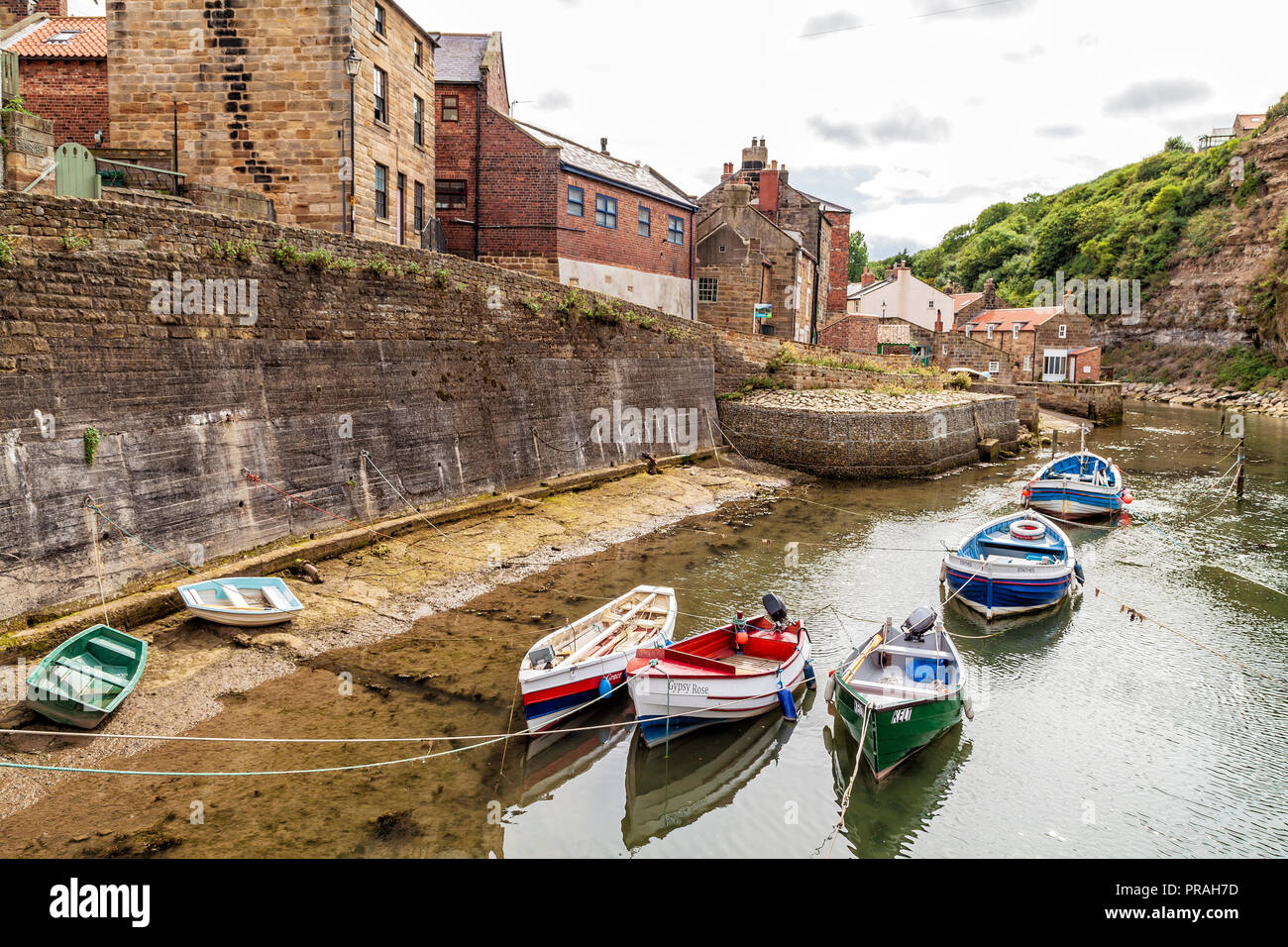 fishing boats in the river at Staithes, Scarborough, North Yorkshire Coast Stock Photo