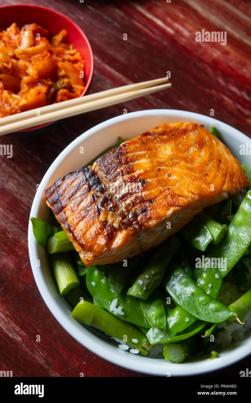 Grilled Salmon on Snow Peas  at Sticky Rice Restaurant Fells Point Baltimore Maryland Stock Photo