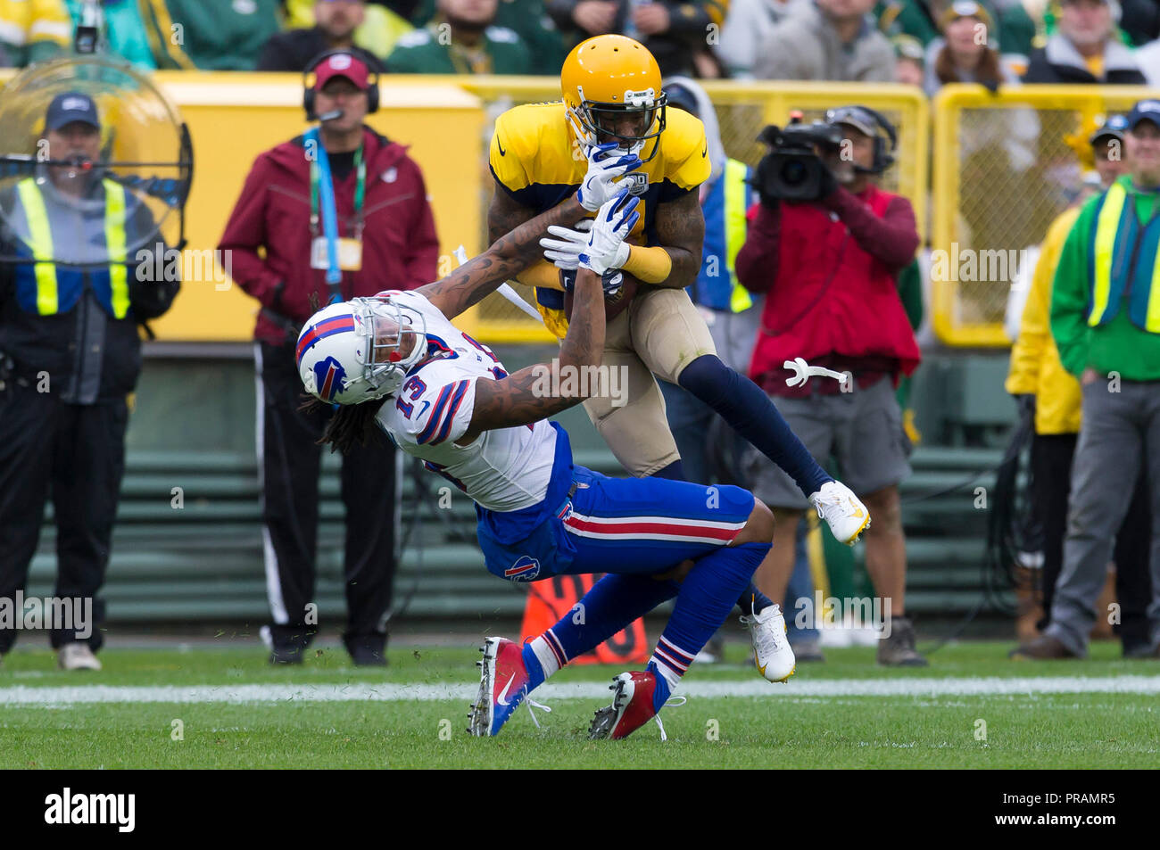 Green Bay, WI, USA. 30th Sep, 2018. Green Bay Packers defensive back Ha Ha Clinton-Dix #21 intercepts a pass while colliding with Buffalo Bills wide receiver Kelvin Benjamin #13 during the NFL Football game between the Buffalo Bills and the Green Bay Packers at Lambeau Field in Green Bay, WI. John Fisher/CSM/Alamy Live News Stock Photo