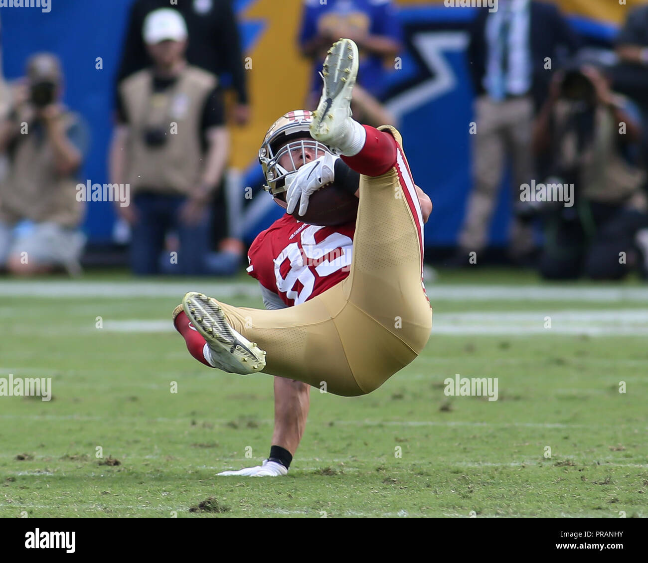 San Francisco 49ers tight end George Kittle (85) walks on the field wearing  a Crucial Catch hoody before an NFL football game against the Seattle  Seahawks, Sunday, Oct. 3, 2021 in Santa