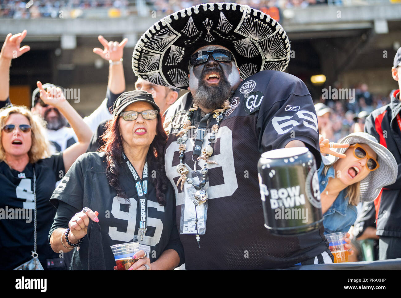 Oakland, California, USA. 30th Sep, 2018. Raider fans cheer on the team, during a NFL game between the Cleveland Browns and the Oakland Raiders at the Oakland Coliseum in Oakland, California. Valerie Shoaps/CSM/Alamy Live News Stock Photo