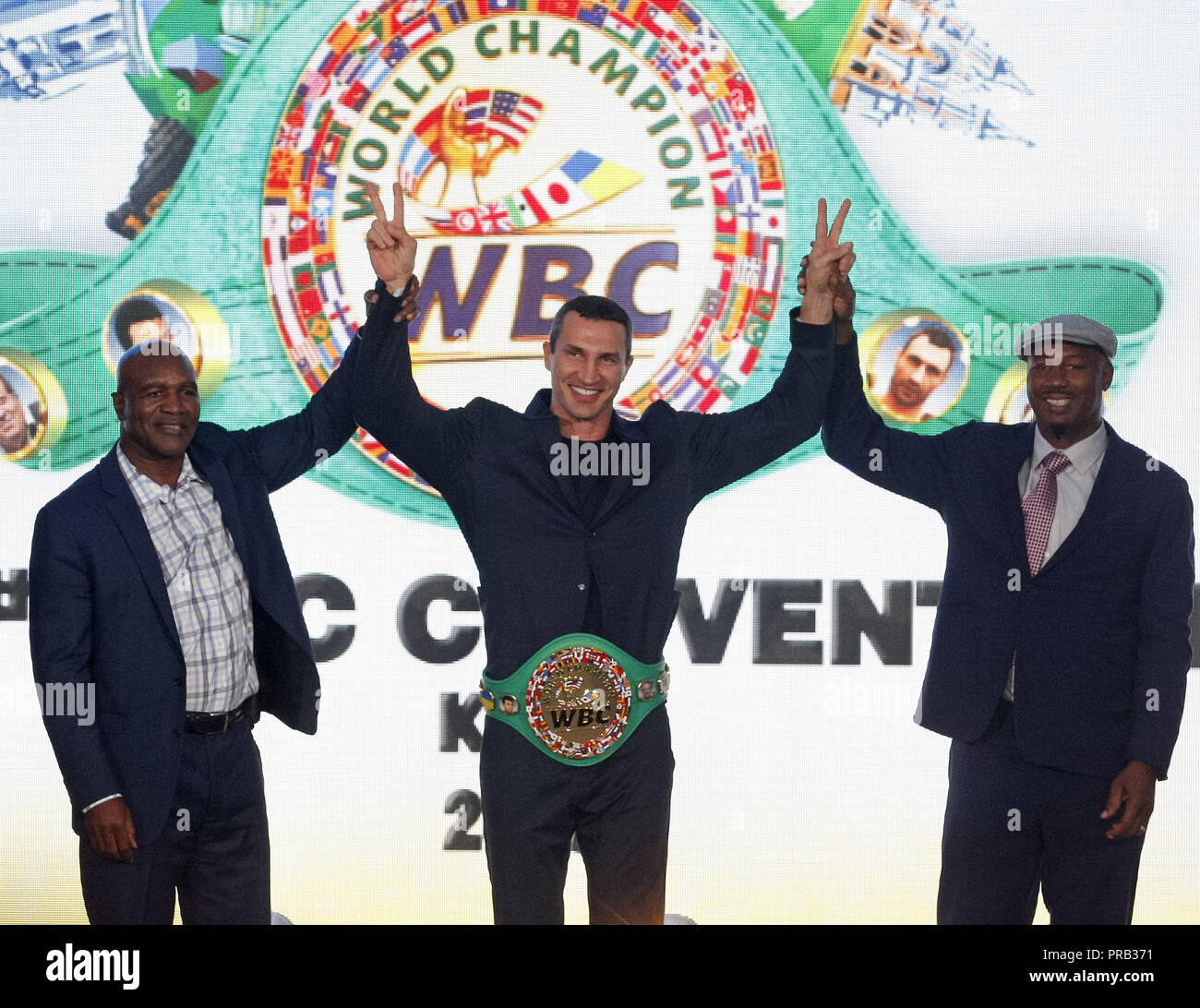 Kiev, Ukraine. 1st Oct, 2018. Former Boxing Champion EVANDER HOLYFIELD (L), Ukrainian boxer VLADIMIR KLITSCHKO (C) and former Boxing Champion LENNOX LEWIS (R) react during awarding of VLADIMIR KLITSCHKO with the belt of the honorary world champion by the WBC version at the opening of the 56th World Boxing Convention in Kiev, Ukraine, on 1 October 2018.The WBC 56th congress in which take part boxing legends Evander Holyfield, Lennox Lewis, Eric Morales and about 700 participants from 160 countries runs in Kiev from from September 30 to October 5. Credit: Serg Glovny/ZUMA Wire/Alamy Live News Stock Photo