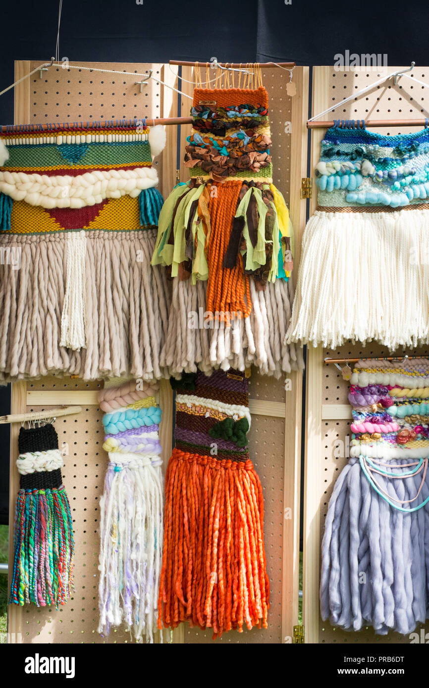 Colorful woven wall hangings for sale. Stock Photo