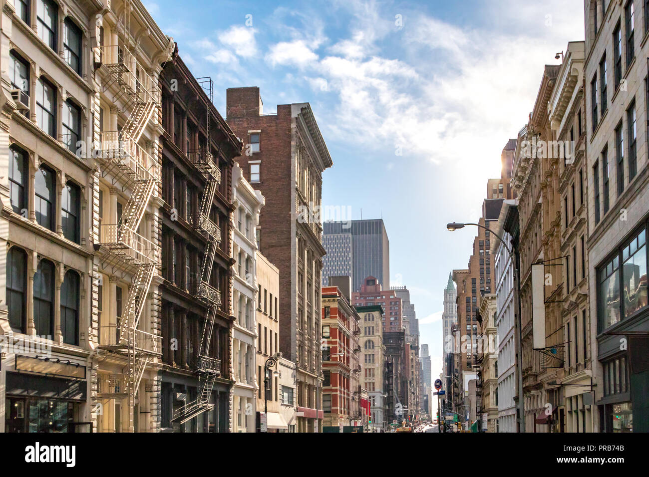Sunlight shines on the buildings along Broadway in SoHo, New York City NYC Stock Photo
