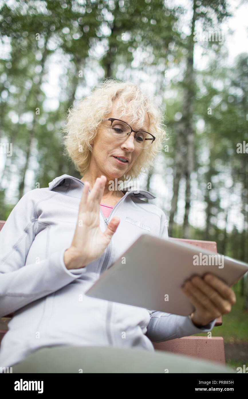 Blonde curly woman waving hi-res stock photography and images - Alamy