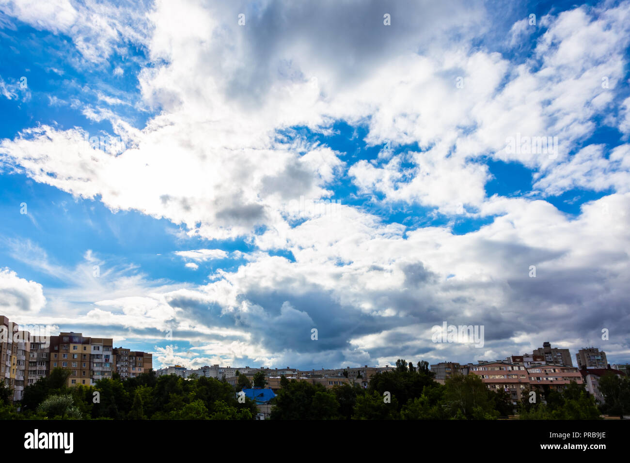 old apartment buildings on blue sky background with clouds Stock Photo ...