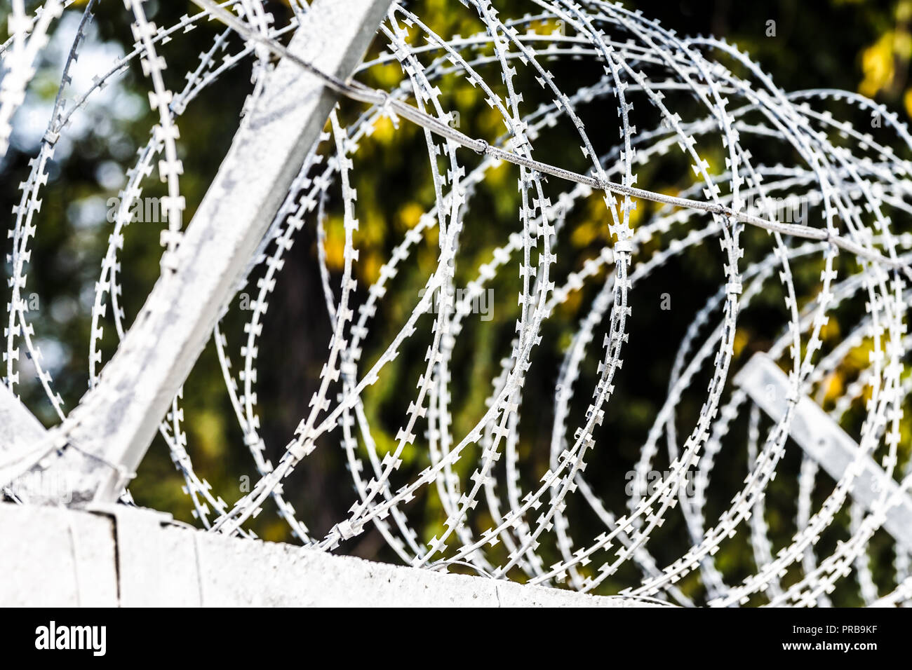 fence with barbed wire, prison concept fenced guarded area, background
