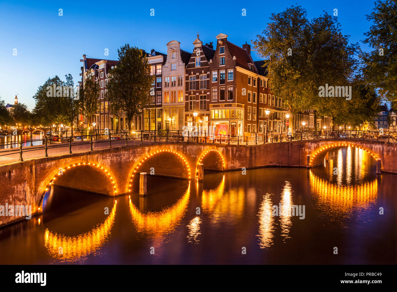 Amsterdam canal Illuminated bridges over the Keizersgracht canal and Leidsegracht canal Amsterdam canals Holland the Netherlands EU Europe Stock Photo