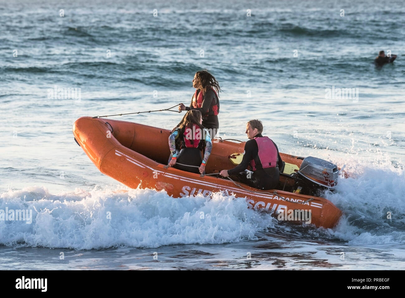 A small RIB Surf Rescue boat in the sea at Fistral in Newquay in Cornwall. Stock Photo