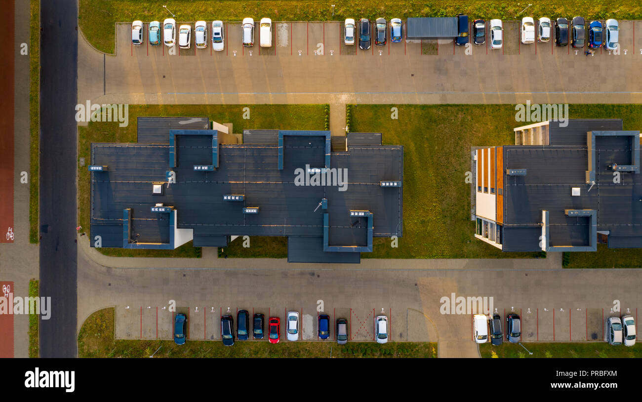 Top down view on multi-family houses and parking with cars. Stock Photo