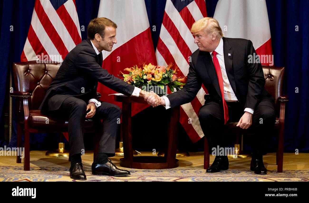 U.S President Donald Trump shakes hands with French President Emmanuel Macron before the start of a bilateral meeting on the sidelines of the United Nations General Assembly meetings September 24, 2018 in New York, New York. Stock Photo