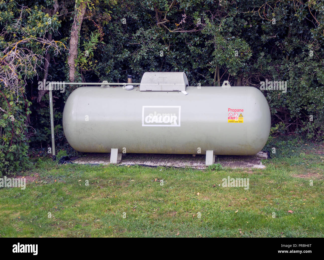A Calor Propane gas storage cylinder supplying gas fuelling a restaurant in a rural location Stock Photo