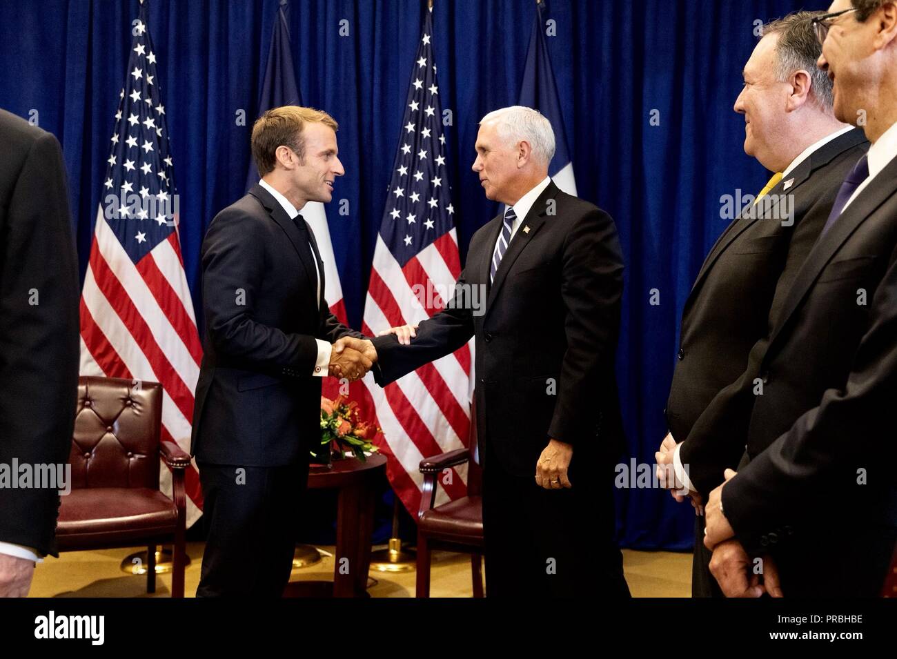 U.S Vice President Mike Pence shakes hands with French President Emmanuel Macron, left, before the start of a bilateral meeting with President Donald Trump on the sidelines of the United Nations General Assembly meetings September 24, 2018 in New York, New York. Stock Photo