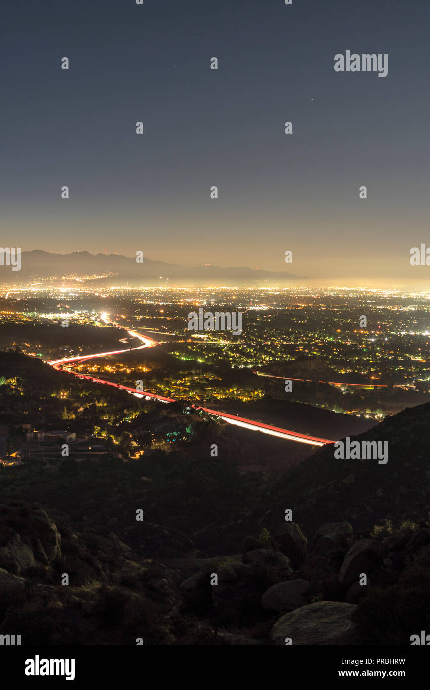 Los Angeles California vertical predawn view of Porter Ranch and the 118 freeway in the San Fernando Valley.  Burbank, North Hollywood and the San Gab Stock Photo