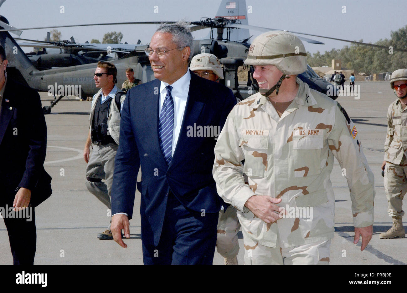 US Army Colonel William Mayville, Commander, 173rd Airborne Brigade (ABN BDE) welcomes US Secretary of State Colin L. Powell upon his arrival at Kirkuk Air Base (AB), Iraq. The Secretary is visiting numerous locations throughout Iraq including Baghdad, and Kirkuk to meet with the troops supporting Operation IRAQI FREEDOM. Stock Photo