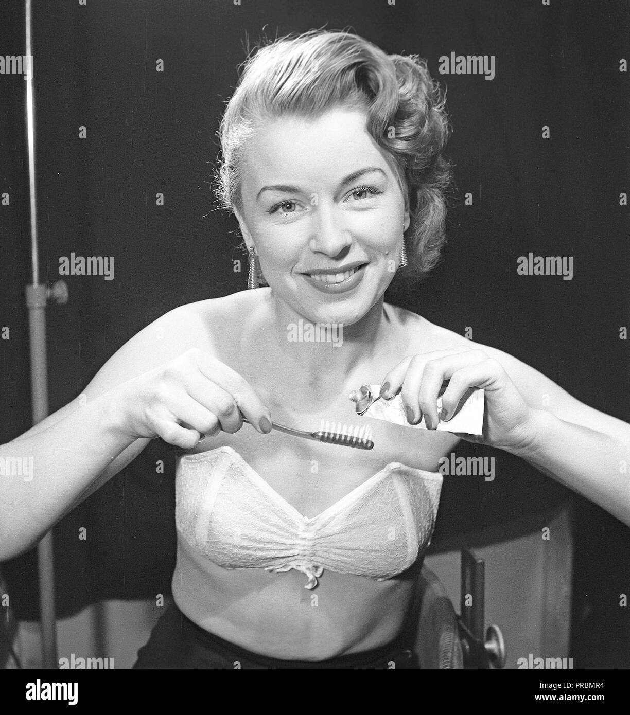 Woman of the 1950s. A woman is posing in typical 1950s underwear