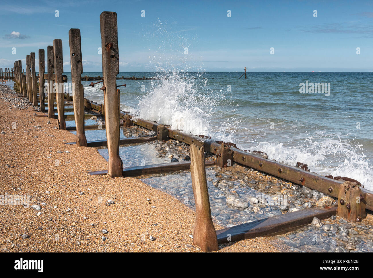 Wooden groynes and revetments, dilapidated on West Runton beach, North
